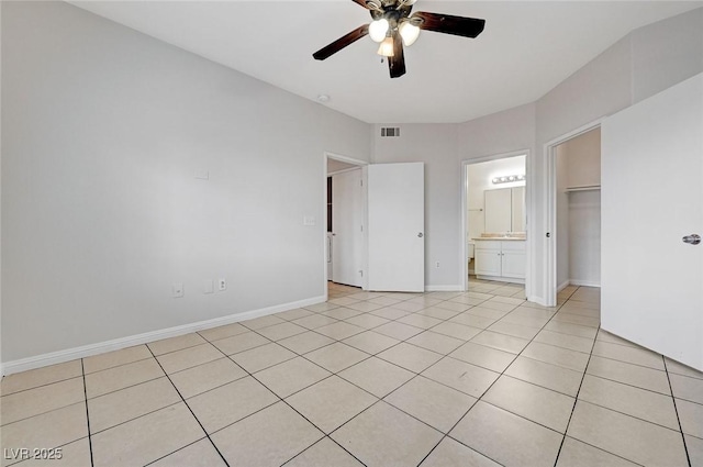 1881 W Alexander Rd Unit 1135, North Las Vegas, NV 89032 - unfurnished bedroom with visible vents, baseboards, connected bathroom, a ceiling fan, and light tile patterned floors