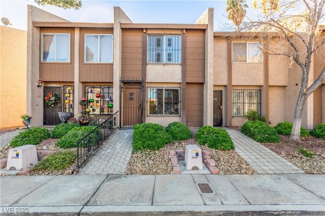 4165 Mississippi Ave, Las Vegas, NV 89103 - view of property featuring stucco siding and a gate