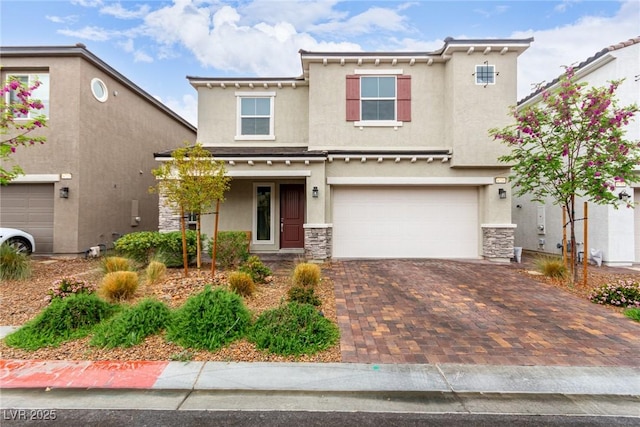 view of front of house with stone siding, a garage, stucco siding, and decorative driveway