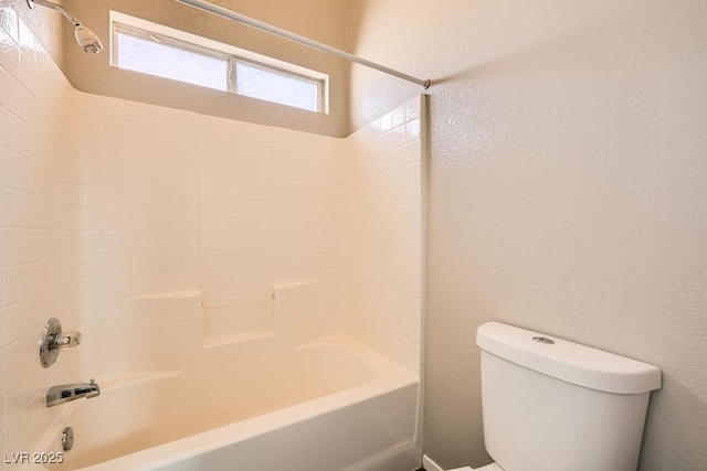 bathroom with toilet and shower / bath combination
