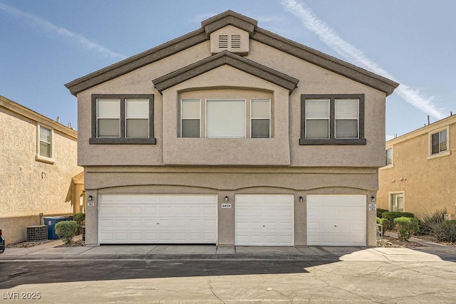 view of front of home featuring a garage and stucco siding