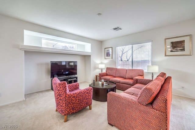 living area with carpet flooring and visible vents