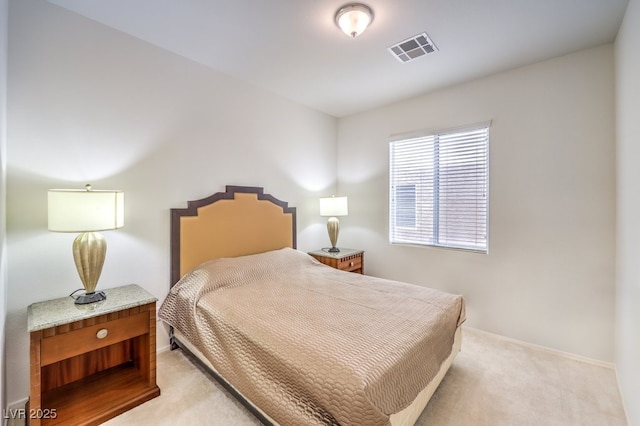 bedroom featuring baseboards, light colored carpet, and visible vents