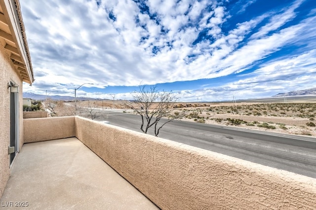 balcony featuring a mountain view
