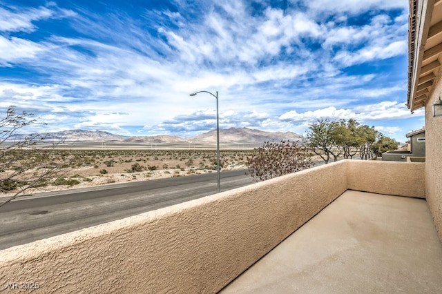 balcony featuring a mountain view