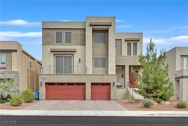 9830 Wild Coyote Ct, Las Vegas, NV 89141 - contemporary house with stucco siding, an attached garage, and driveway