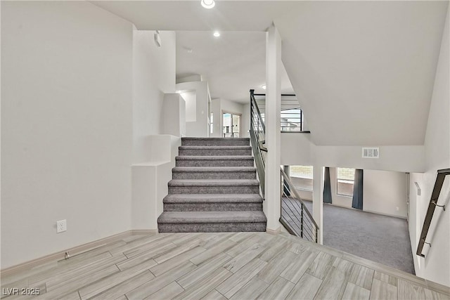 9830 Wild Coyote Ct, Las Vegas, NV 89141 - stairs featuring wood finished floors, baseboards, and recessed lighting