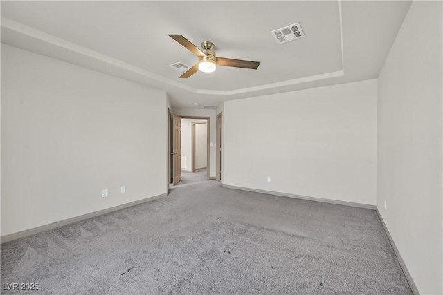 9830 Wild Coyote Ct, Las Vegas, NV 89141 - empty room featuring carpet flooring, a ceiling fan, a raised ceiling, and baseboards