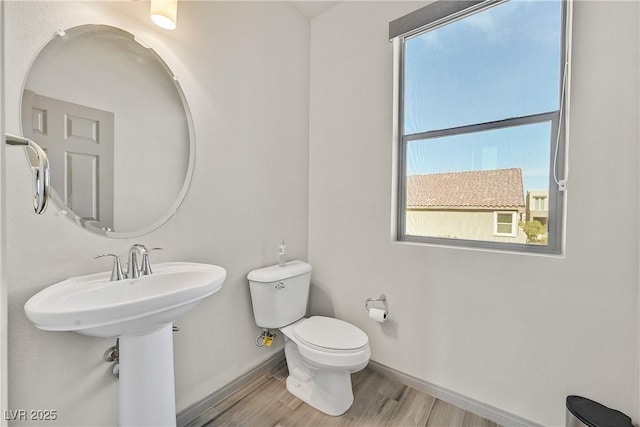 9830 Wild Coyote Ct, Las Vegas, NV 89141 - bathroom featuring wood finished floors, baseboards, and toilet