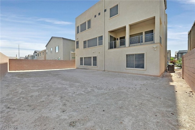 9830 Wild Coyote Ct, Las Vegas, NV 89141 - back of house featuring central AC unit and stucco siding