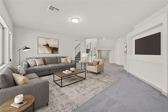 9830 Wild Coyote Ct, Las Vegas, NV 89141 - living room featuring carpet floors, stairway, and baseboards
