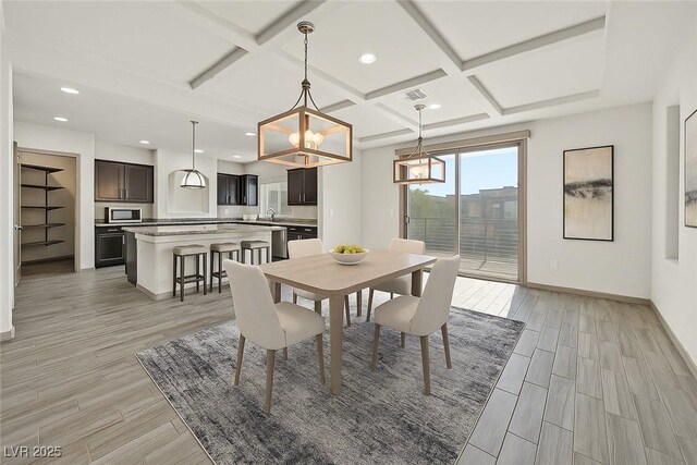 9830 Wild Coyote Ct, Las Vegas, NV 89141 - dining room with coffered ceiling, light wood-style flooring, baseboards, beam ceiling, and recessed lighting