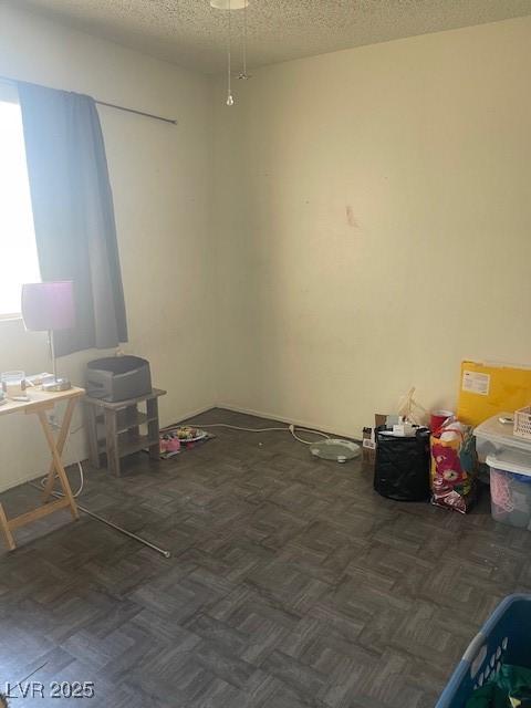 empty room with a textured ceiling