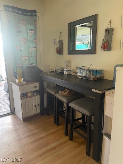 dining area featuring light wood-style flooring