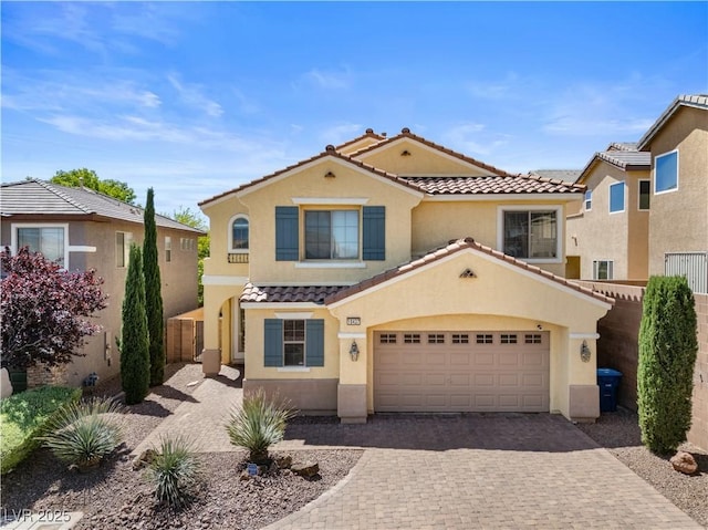 10437 Walworth Ave, Las Vegas, NV 89166 - mediterranean / spanish-style home featuring a tile roof, fence, stucco siding, and decorative driveway
