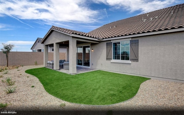 312 Parawan St Lot 12, Henderson, NV 89015 - rear view of property with a tile roof, fence private yard, stucco siding, a yard, and a patio area