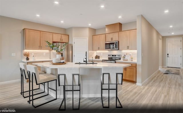 312 Parawan St Lot 12, Henderson, NV 89015 - kitchen featuring light brown cabinets, light countertops, a sink, and appliances with stainless steel finishes