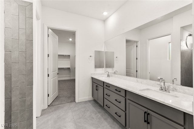 31 Autumn Palm Ave, Henderson, NV 89011 - full bathroom featuring double vanity, tile patterned floors, a spacious closet, recessed lighting, and baseboards