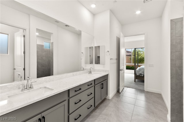 31 Autumn Palm Ave, Henderson, NV 89011 - bathroom featuring baseboards, double vanity, tile patterned floors, connected bathroom, and recessed lighting