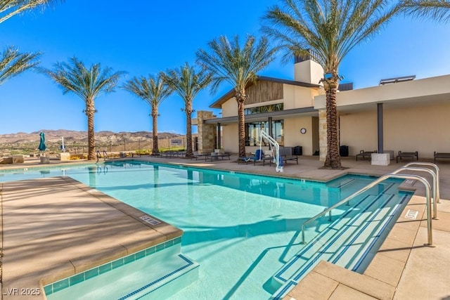 31 Autumn Palm Ave, Henderson, NV 89011 - community pool with a mountain view and a patio