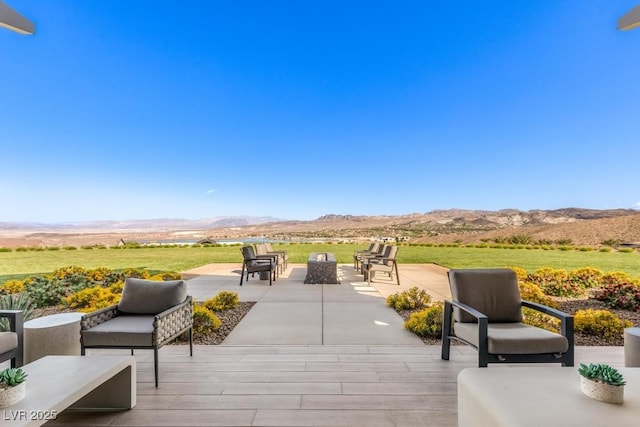 31 Autumn Palm Ave, Henderson, NV 89011 - view of patio / terrace with a mountain view and an outdoor living space