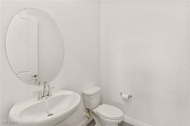31 Autumn Palm Ave, Henderson, NV 89011 - bathroom with a sink, baseboards, and toilet