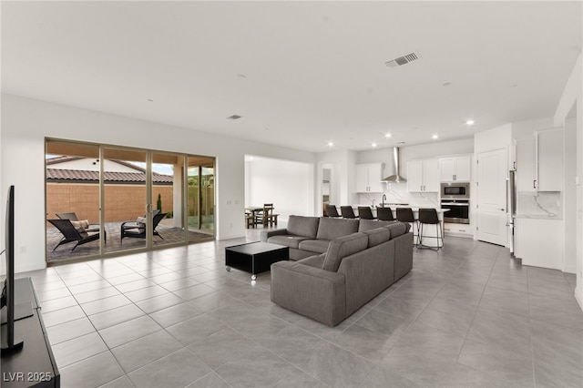 31 Autumn Palm Ave, Henderson, NV 89011 - living room featuring recessed lighting and light tile patterned floors