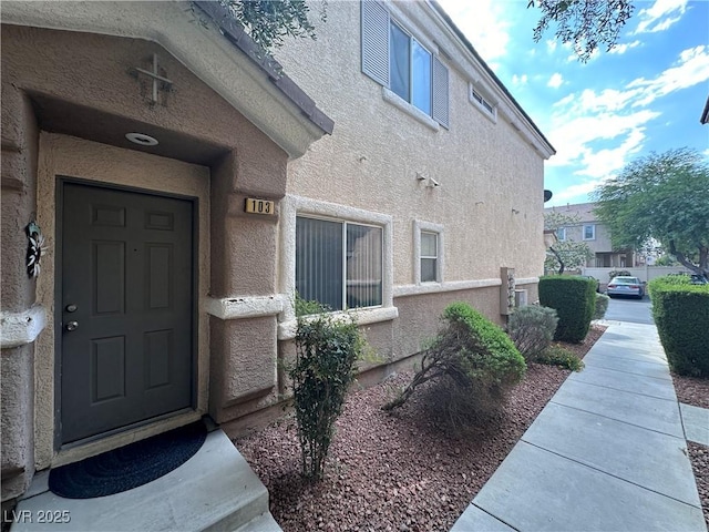 6080 Golden Corral Trl Unit 103, Henderson, NV 89011 - doorway to property with stucco siding