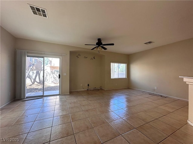 6080 Golden Corral Trl Unit 103, Henderson, NV 89011 - spare room featuring light tile patterned flooring, ceiling fan, and baseboards