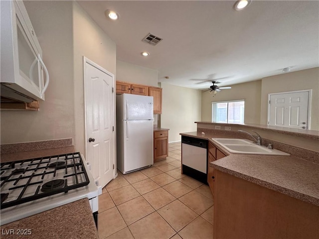 6080 Golden Corral Trl Unit 103, Henderson, NV 89011 - kitchen with white appliances, a sink, a ceiling fan, light tile patterned floors, and recessed lighting