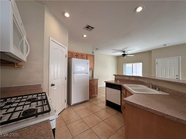 6080 Golden Corral Trl Unit 103, Henderson, NV 89011 - kitchen featuring white appliances, a sink, ceiling fan, light tile patterned flooring, and recessed lighting