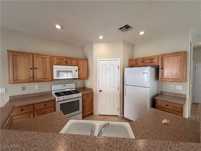 6080 Golden Corral Trl Unit 103, Henderson, NV 89011 - kitchen featuring white appliances, a sink, light tile patterned flooring, and recessed lighting