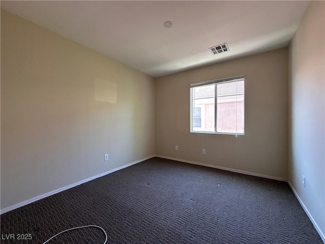 6080 Golden Corral Trl Unit 103, Henderson, NV 89011 - unfurnished room featuring dark carpet and baseboards