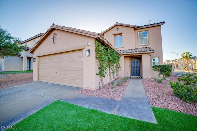 mediterranean / spanish-style home with concrete driveway, stucco siding, fence, a tiled roof, and a garage