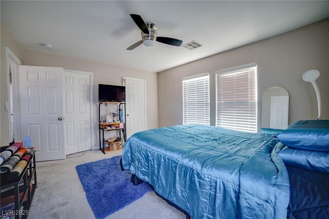bedroom featuring a ceiling fan, carpet floors, and visible vents