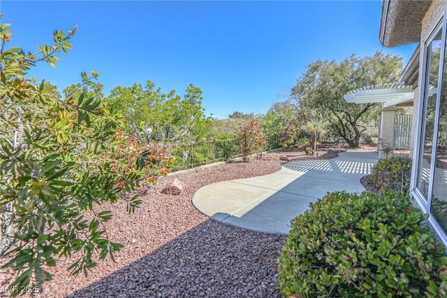 view of yard with a pergola and a patio area