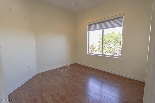unfurnished room with baseboards, a ceiling fan, and wood-type flooring