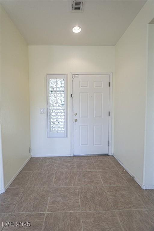 entryway featuring baseboards and visible vents