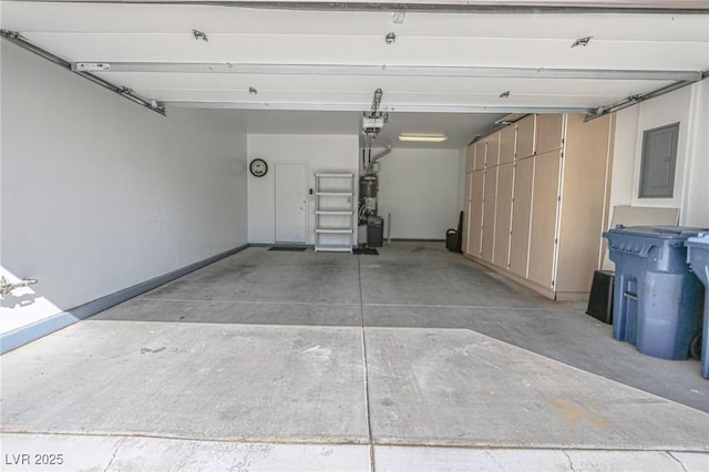 garage with baseboards, a garage door opener, and electric panel