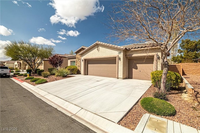 5224 E San Palo Dr, Pahrump, NV 89061 - view of front of home with stucco siding, fence, an attached garage, a tiled roof, and driveway