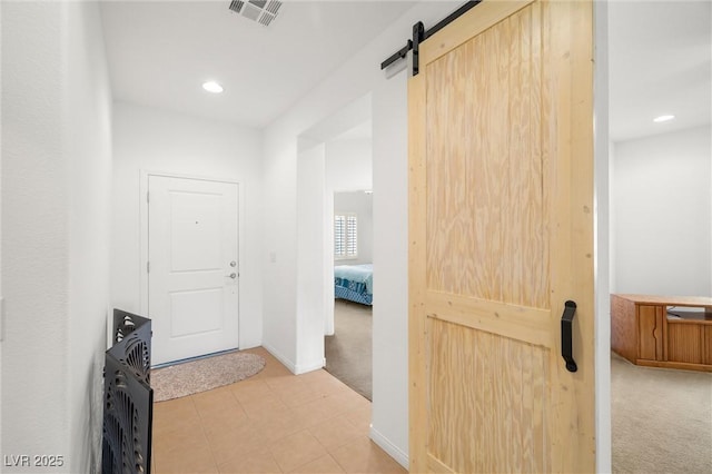 5224 E San Palo Dr, Pahrump, NV 89061 - hall with a barn door, visible vents, recessed lighting, and light colored carpet