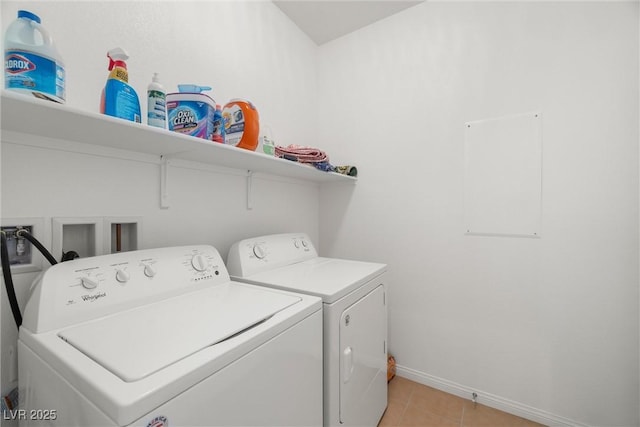 5224 E San Palo Dr, Pahrump, NV 89061 - laundry room featuring light tile patterned flooring, washer and clothes dryer, laundry area, and baseboards