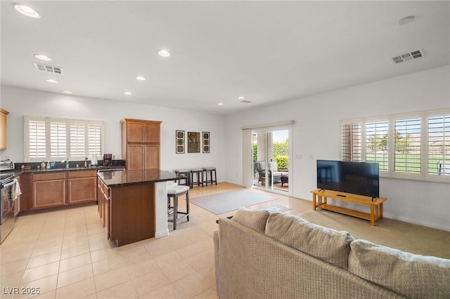 5224 E San Palo Dr, Pahrump, NV 89061 - living room with visible vents, recessed lighting, and light tile patterned floors