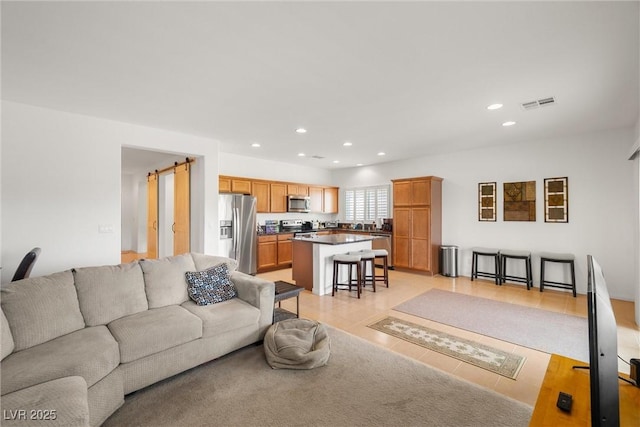 5224 E San Palo Dr, Pahrump, NV 89061 - living room featuring visible vents, recessed lighting, and light tile patterned floors