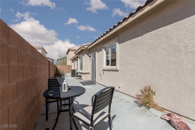view of patio featuring a fenced backyard and central AC