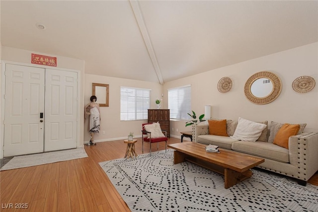 living room with light wood-type flooring and baseboards