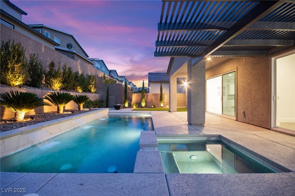 2670 Summit Springs St, Henderson, NV 89044 - view of pool featuring a fenced backyard, a pool with connected hot tub, and a patio area