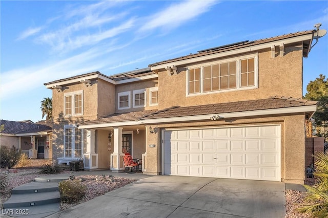 9578 Teton Vista Ave, Las Vegas, NV 89117 - traditional home featuring stucco siding, an attached garage, and concrete driveway
