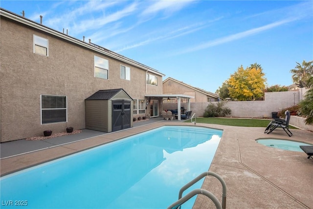 9578 Teton Vista Ave, Las Vegas, NV 89117 - view of pool featuring a fenced in pool, an outdoor structure, a fenced backyard, a patio, and a storage unit