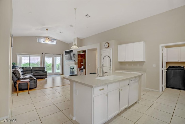 kitchen featuring light tile patterned flooring, light countertops, a sink, a ceiling fan, and dishwasher